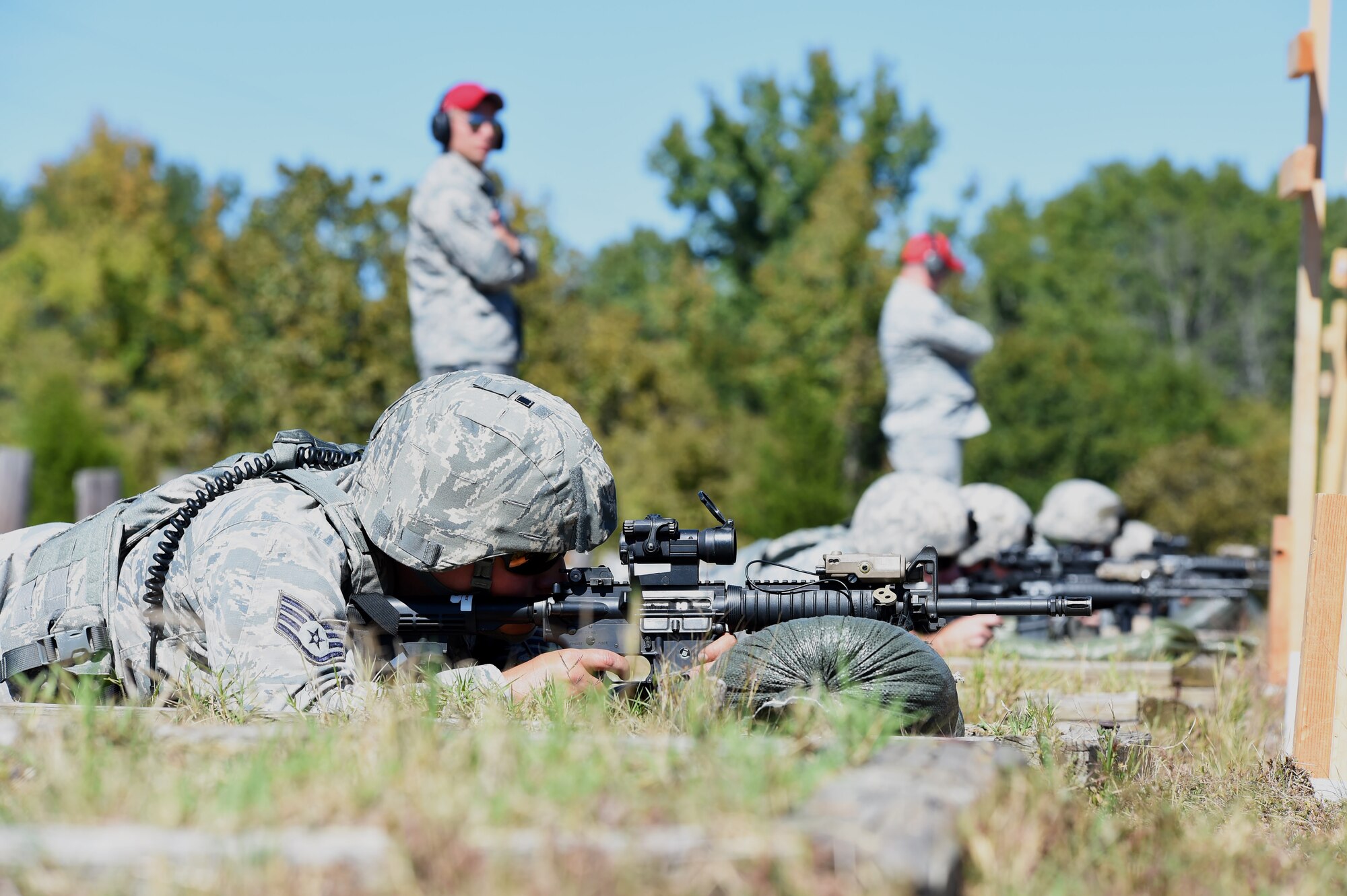 Staff Sgt. Nathanael Stewart, 188th Security Forces specialist, and other members of the 188th SFS fire at their targets Oct. 3, 2015 during weapons training on the M4 carbine rifle at Fort Chaffee Joint Maneuver Training Center, Ark. Marksmanship training helps to ensure SFS Airman remain proficient with their service weapons.   (U.S. Air National Guard photo by Senior Airman Cody Martin/Released)