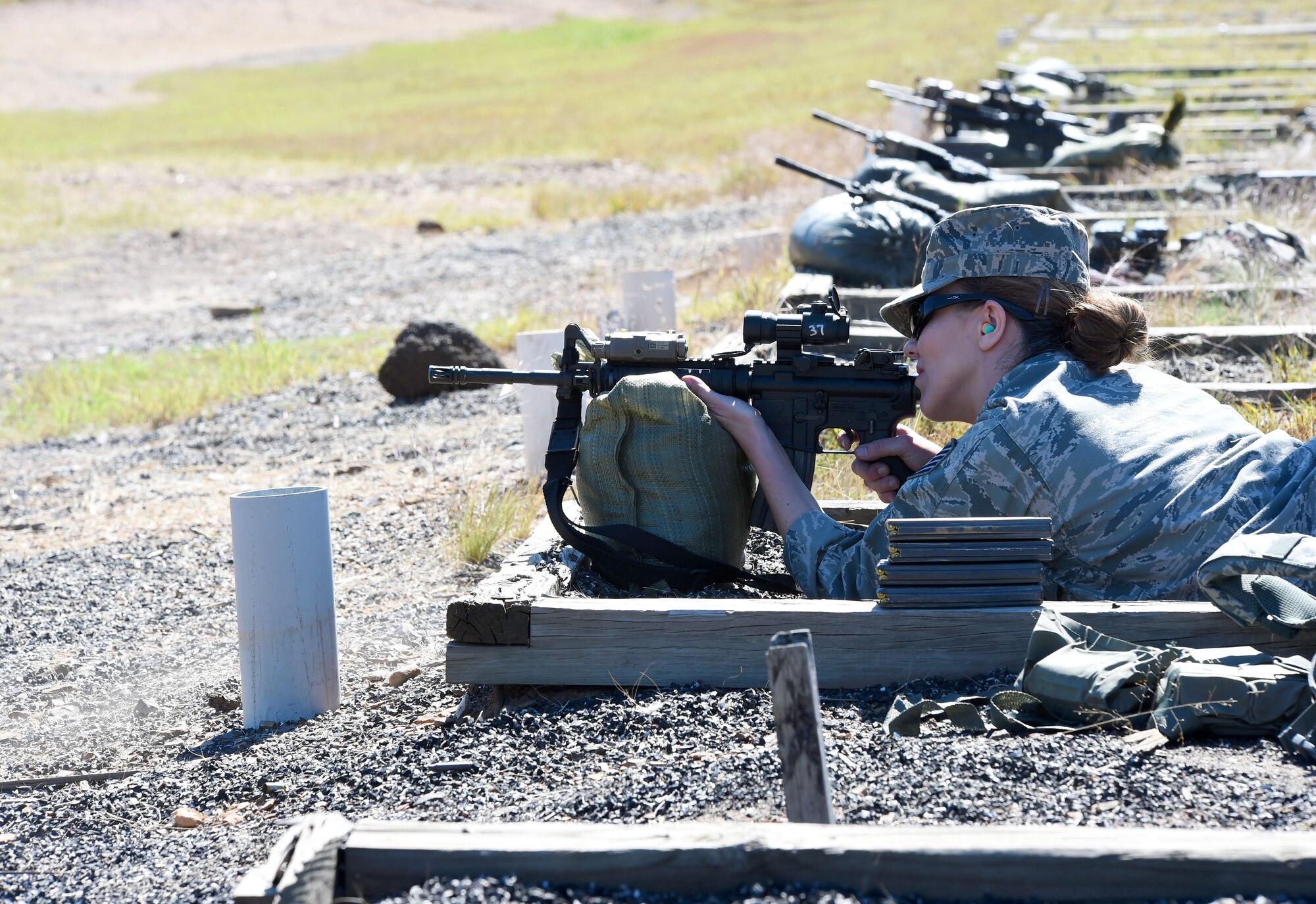 Tech. Sgt. Kelly Webb, 188th Security Forces Squadron information protection specialist, zeroes in her sights on the M4 carbine rifle during weapons proficiency training Oct. 3, 2015 at Fort Chaffee Joint Maneuver Training Center, Ark. Marksmanship training helps to ensure SFS Airman remain proficient with their service weapons. (U.S. Air National Guard photo by Senior Airman Cody Martin/Released)