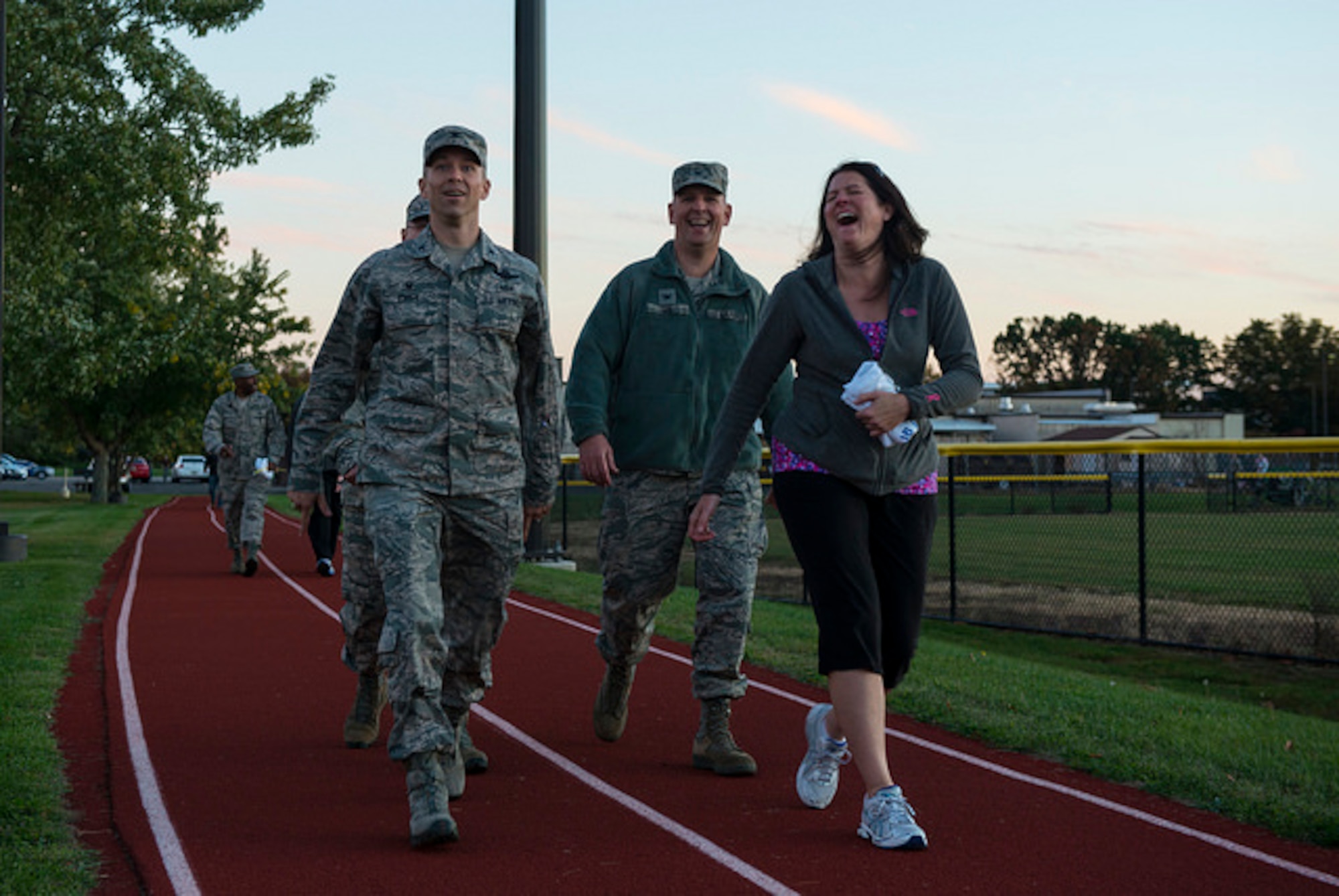 Col. John Price, 305th Air Mobility Wing commander, walks with members of
the joint base community during the Vigil Against Violence on Joint Base
McGuire-Dix-Lakehurst, N.J. Oct. 14. The Vigil Against Violence is an annual sunset walk to raise awareness about domestic violence and sexual assault. (U.S. Air Force photo by Airman 1st Class Joshua King)