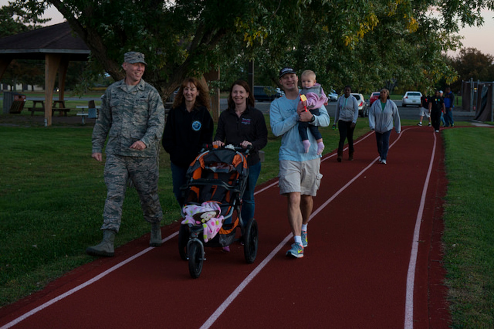 Joint base community members walk during the Vigil Against Violence on Joint Base McGuire-Dix-Lakehurst, N.J. Oct. 14. The Vigil Against Violence is an annual sunset walk to raise awareness about domestic violence and sexual assault. (U.S. Air Force photo by Airman 1st Class Joshua King)