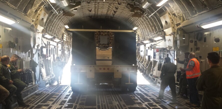 Airmen with the 62nd Airlift Wing and Soldiers with the 5th Battalion, 5th Air Defense Artillery, load a Land Based Phalanx Weapons System onto a C-17 Globemaster III during a joint operation training mission on Joint Base Lewis-McChord, Wash. Oct. 1, 2015. The 75,000 pounds Counter Rocket, Artillery and Mortar trailer was loaded, in less than 20 minutes, onto the aircraft to simulate a real world short notice deployment.  (U.S. Air Force courtesy photo)