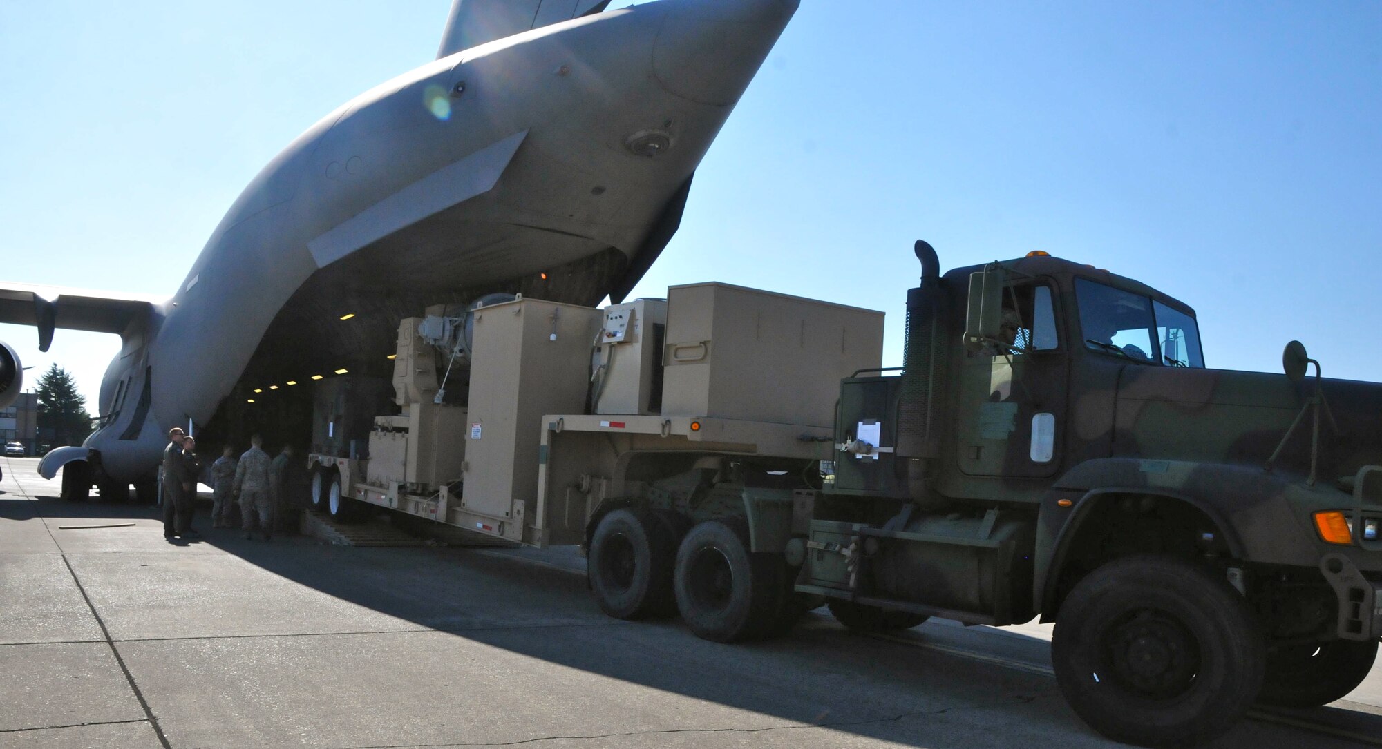 Soldiers with 5th Battalion, 5th Air Defense Artillery, conduct a joint operation training mission with the 62nd Airlift Wing on McChord Field, Joint Base Lewis-McChord, Wash. Oct. 1, 2015. The training consisted of loading a Land Based Phalanx Weapons System onto a C-17 Globemaster III. (U.S. Army photo/Sgt. Quanesha Deloach)