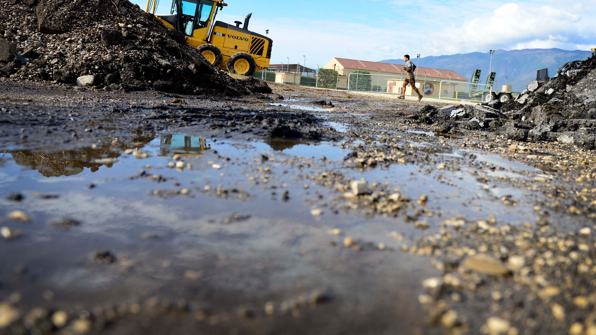 U.S. Air Force Airman 1st Class Sergio Fortich, 31st Logistics Readiness Squadron petroleum, oils and lubricants mobile distribution operator, participates in the Wyvern Mud Run, Oct. 17, 2015, at Aviano Air Base, Italy. The Wing Diversity Council and 31st Civil Engineer Squadron hosted the event, which awarded prizes to the top male and female, top team and top squadron team. (U.S. Air Force photo by Senior Airman Areca T. Bell/Released)