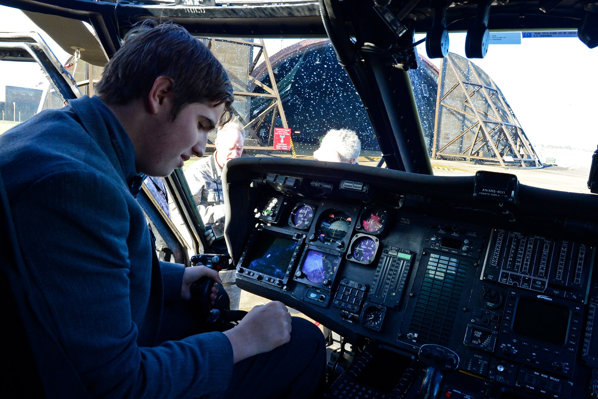 A Lakenheath High School senior sits in the cockpit of an HH-60G Pave Hawk at Royal Air Force Lakenheath, England, Oct. 14, 2015, during their educational field trip to learn about the mission of the 48th Fighter Wing. The event gave LHS seniors the opportunity to gain an appreciation and understanding of the mission at RAF Lakenheath. (U.S. Air Force photo by Airman 1st Class Erin R. Babis/Released)