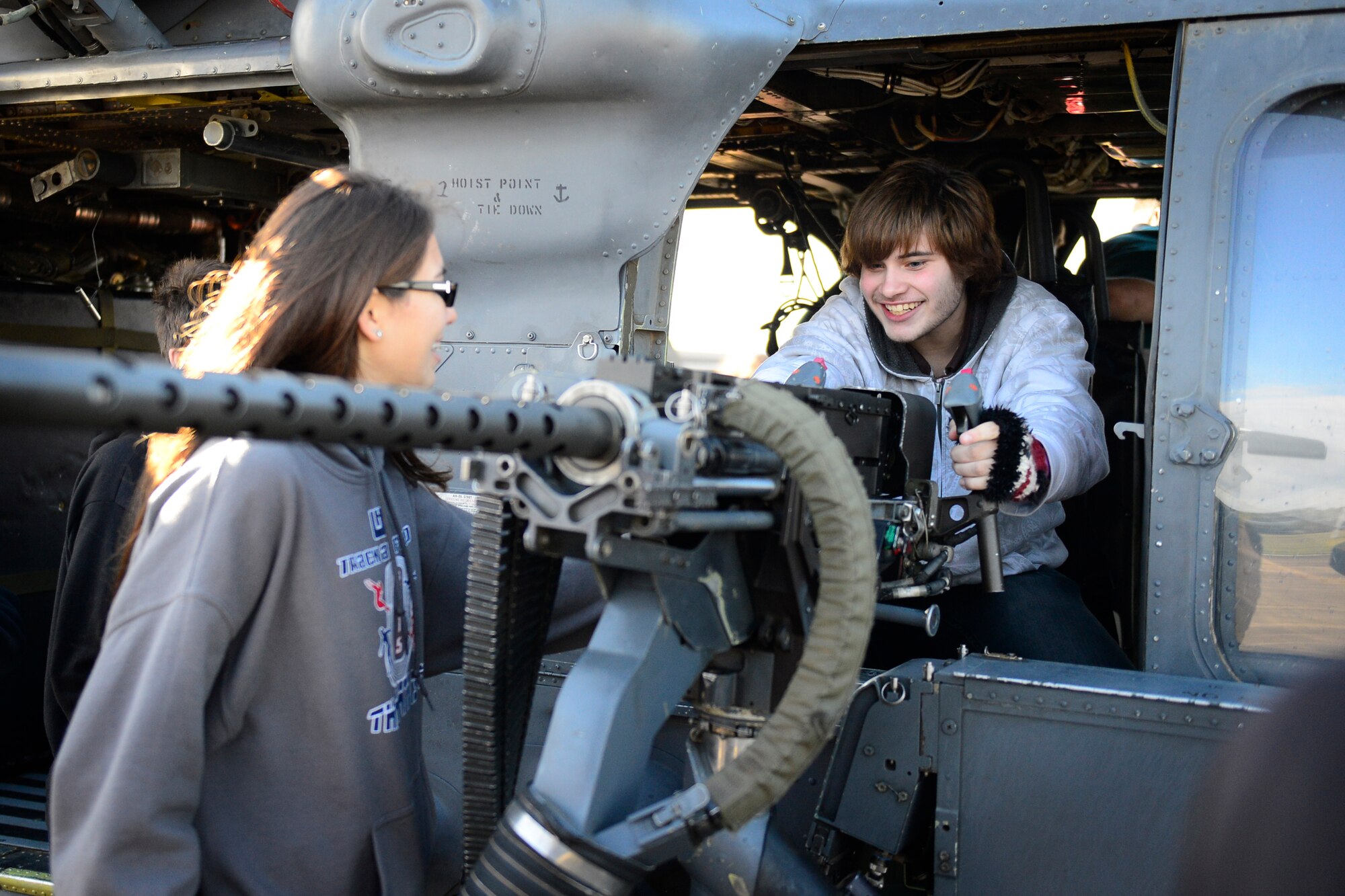 Lakenheath High School seniors check out an HH-60G Pave Hawk machine gun at Royal Air Force Lakenheath, England, Oct. 14, 2015, during an educational visit to learn about the mission of the 48th Fighter Wing. The event gave LHS seniors the opportunity to gain an appreciation and understanding of the mission at RAF Lakenheath. (U.S. Air Force photo by Airman 1st Class Erin R. Babis/Released)