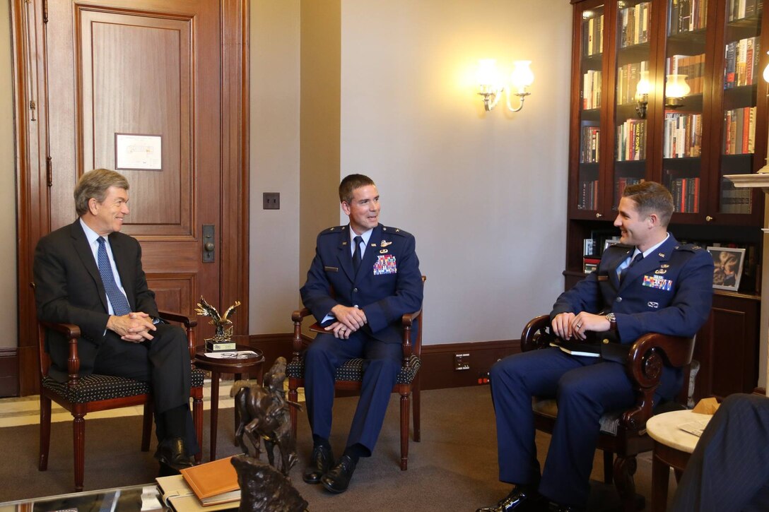 U.S. Air Force Brig. Gen. Paul W. Tibbets IV, 509th Bomb Wing commander, center, and Capt. Kyle Boomer, 509th Civil Engineer Squadron explosive ordnance disposal flight commander, right, speak to Roy Blunt, Missouri Senator, during an annual visit to Capitol Hill at Washington, D.C., Oct. 7, 2015. Tibbets, also accompanied by Staff Sgt. Brian Schroeder, 509th Aircraft Maintenance Squadron crew chief, met with Blunt, Clair McCaskill, Missouri Senator, and Vicky Hartzler, 4th Congressional District Congresswoman, to discuss how Congress can help support the mission and residents of Whiteman Air Force Base, Mo. Boomer and Schroeder also has the opportunity to provide insight from their experience within their career fields as active-duty service members. (Courtesy photo)