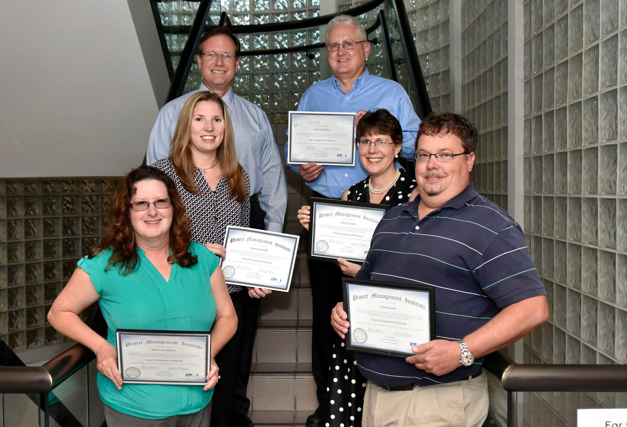 Five ATA team members recently received their Project Management Professionals® certification from the Project Management Institute®. Founded in 1969, PMI is a not-for-profit professional membership association for the project, program and portfolio management profession. To become a PMP, you are required to meet specific educational and work experience criteria and pass a four hour exam. Pictured with Information Technology and Systems Department Director Mark Rigney, top left; (clockwise, from top right) certified Project Management Professionals Bob Schwer, Aeropropulsion Systems Acquisition section manager; Karen Zarecor Instrumentation and Controls project manager and database administrator; Trent Loman, Instrumentation and Controls project manager and IT&S Core Process manager; Sabrina Williams, Instrumentation and Controls Project Execution section manager; and Kristen Deardorff, Instrumentation and Controls project manager and Test Data and Measurement Systems architect. (Photo by Jacqueline Cowan)

-AEDC-

