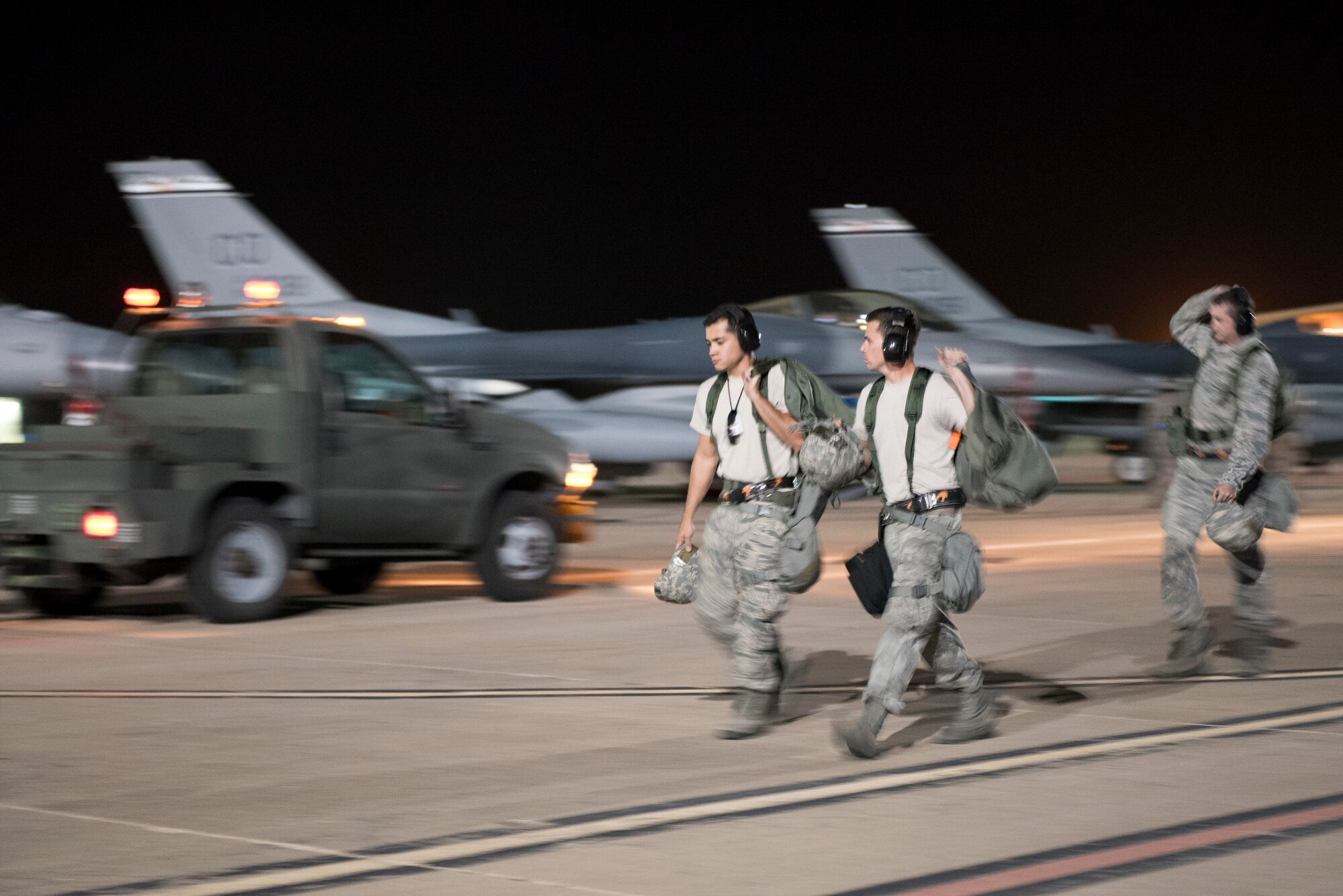 U.S. Airmen from the 140th Maintenance Squadron, Colorado Air National Guard, exit the flight line after loading bombs onto F-16's during a Wing Wartime Readiness Inspection, Buckley Air Force Base, Colo., Oct. 16, 2015. The WWRI is a four-day inspection that tests and evaluates the 140th Wing on critical requirements to ensure mission readiness for real world deployments. (U.S. Air National Guard photo by Senior Airman Michelle Y. Alvarez-Rea)
