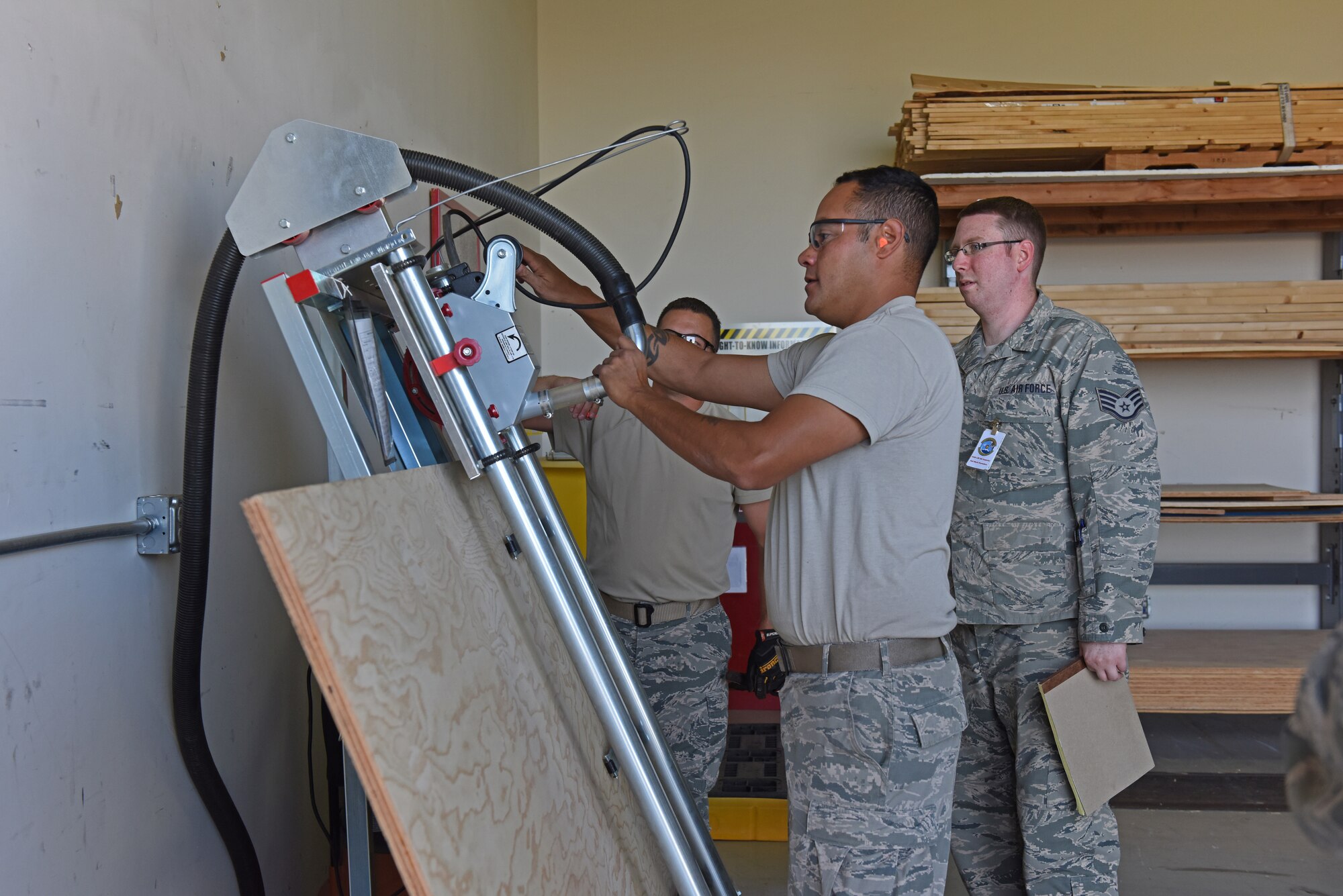 U.S. Air Force Tech. Sgt. Robert Isaac, 140th Logistics Readiness Squadron, Colorado Air National Guard, demonstrates proper use of a panel saw to an inspector during a Wing Wartime Readiness Inspection, Buckley Air Force Base, Colo., Oct. 17, 2015. The WWRI is part of the new Air Force Inspection System which focuses on evaluating mission readiness instead of inspection readiness, allowing commanders to concentrate on strengthening the force by improving mission effectiveness every day. (U.S. Air National Guard photo by Senior Airman Michelle Y. Alvarez-Rea)