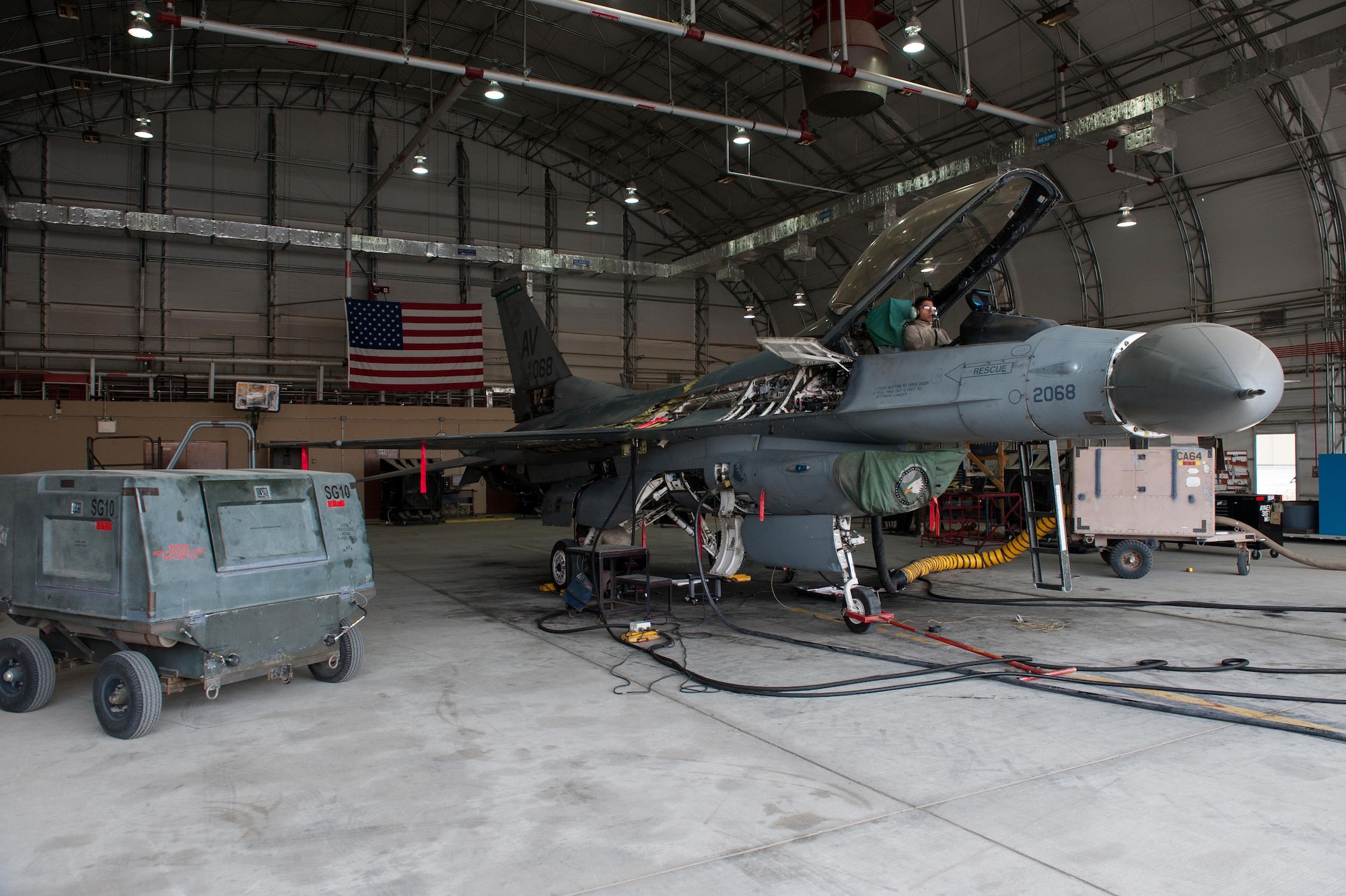 U.S. Air Force Airman 1st Class Omar Segusulaiman assigned to the 455th Expeditionary Maintenance Squadron sits in the cockpit of an F-16 Fighting Falcon aircraft during a 400 hour phase inspection on an F-16 Fighting Falcon aircraft Oct. 18, 2015, at Bagram Airfield, Afghanistan. The 455th EMXS Airmen completed 32 phases during their six month deployment topping the average by 33%. (U.S. Air Force photo by Tech. Sgt. Joseph Swafford/Released)