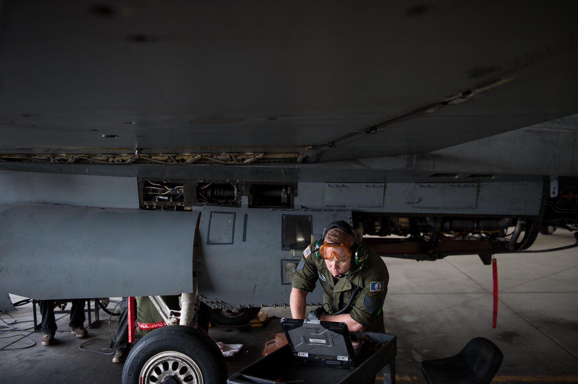 U.S. Air Force Staff Sgt. Matthew Lawson assigned to the 455th Expeditionary Maintenance Squadron, works to complete a 400-hour phase inspection on an F-16 Fighting Falcon aircraft Oct. 18, 2015, at Bagram Airfield, Afghanistan. The 455th EMXS Airmen completed 32 phases during their six month deployment topping the average by 33 percent (U.S. Air Force photo by Tech. Sgt. Joseph Swafford/Released)