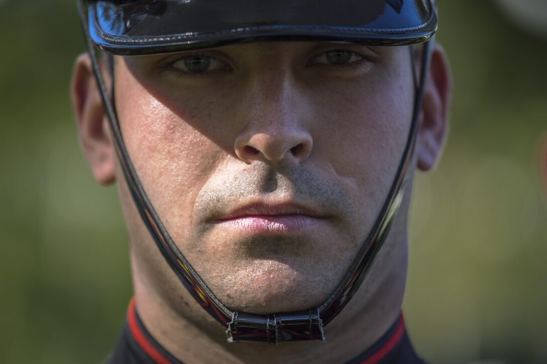 A Marine from Marine Barracks Washington, D.C., poses for a portrait at the Arlington National Cemetery, Arlington, Va., Oct. 15, 2015. Marines from Marine Barracks Washington are responsible for providing services for Marine Corps' Military Honors funerals. (U.S. Marine Corps Photo by Cpl. Remington Hall/Released)