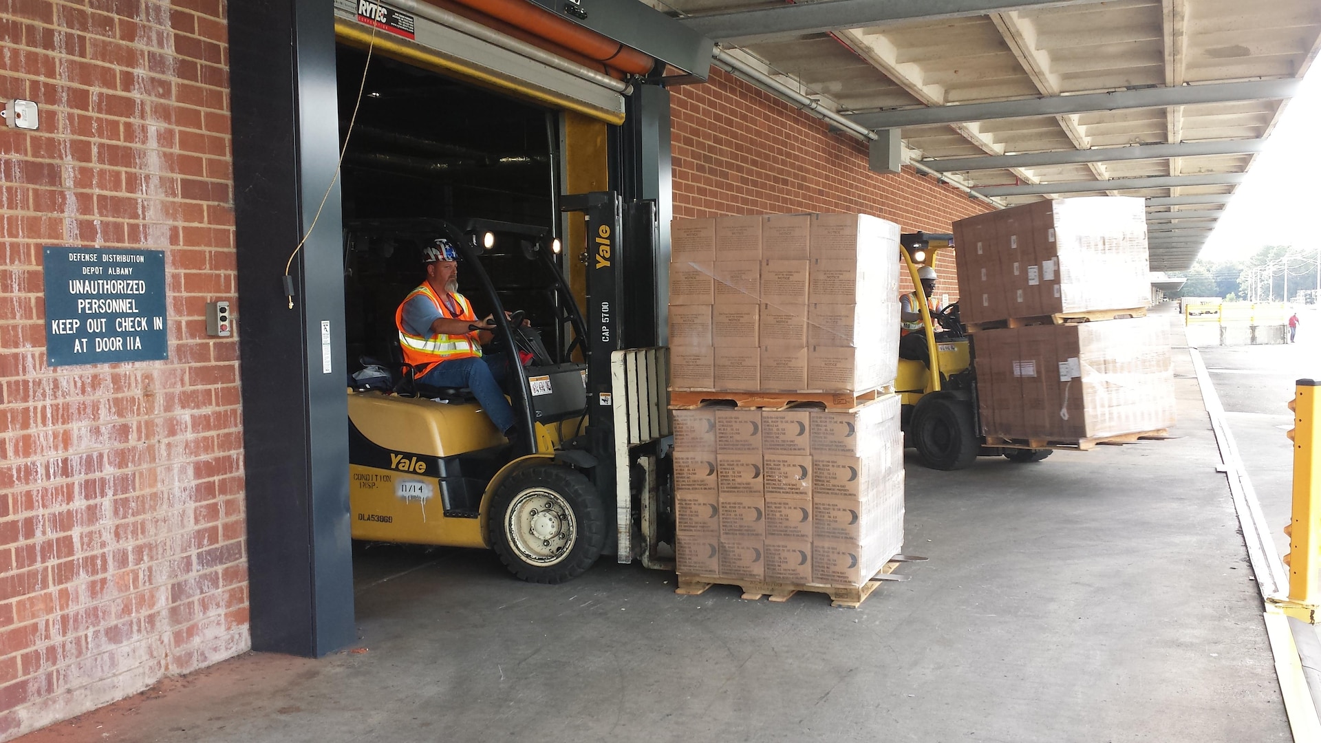 A DLA Distribution Albany employee moves a pallet of MRE’s to be shipped to Fort Jackson, S.C., to aid in the Hurricane Joaquin disaster relief.