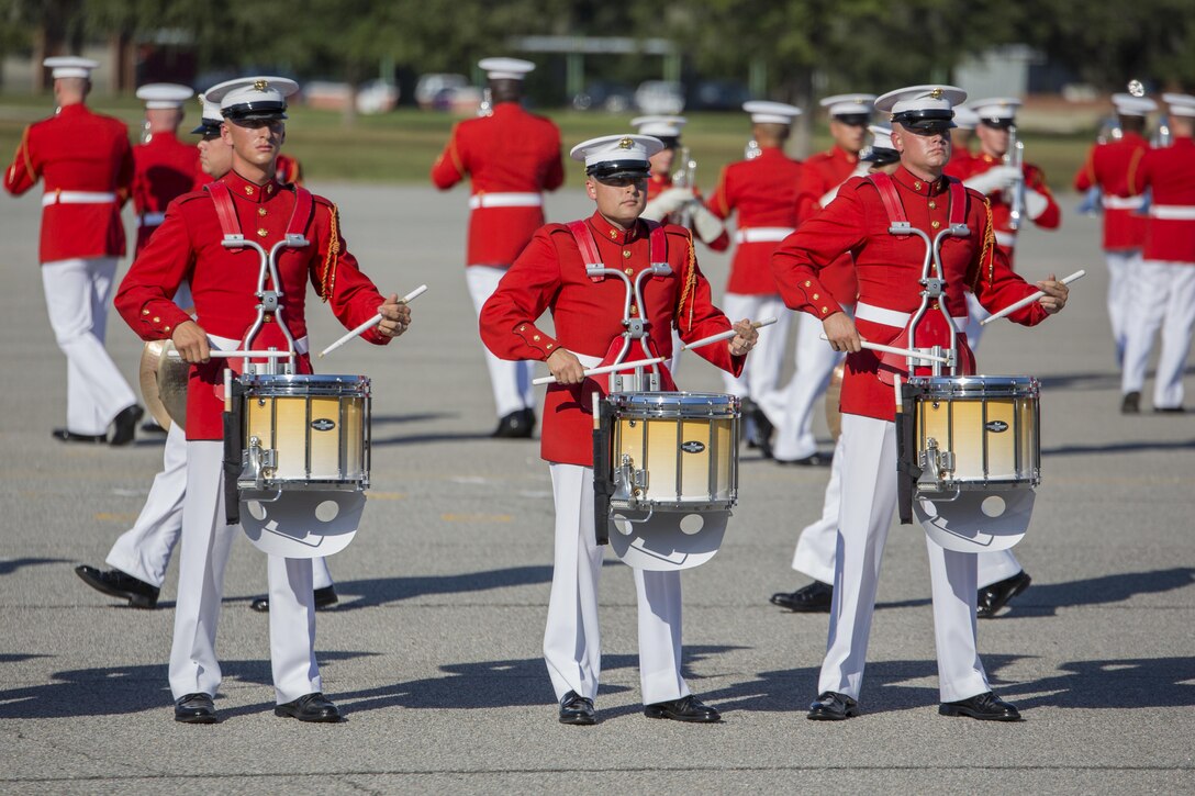 Marines with the U.S. Marine Drum and Bugle Corps play during a performance Oct. 16, 2015, on Parris Island, S.C. The Marines played a variety of modern and traditional marching music before an audience of recruits, Marines and civilians. The drum corps is part of the Battle Color Detachment, based at Marine Barracks Washington, D.C. The detachment travels across the nation and abroad providing ceremonial musical support and entertainment. The performance was part of Parris Island’s Centennial. (Photo by Lance Cpl. Vanessa Austin)
