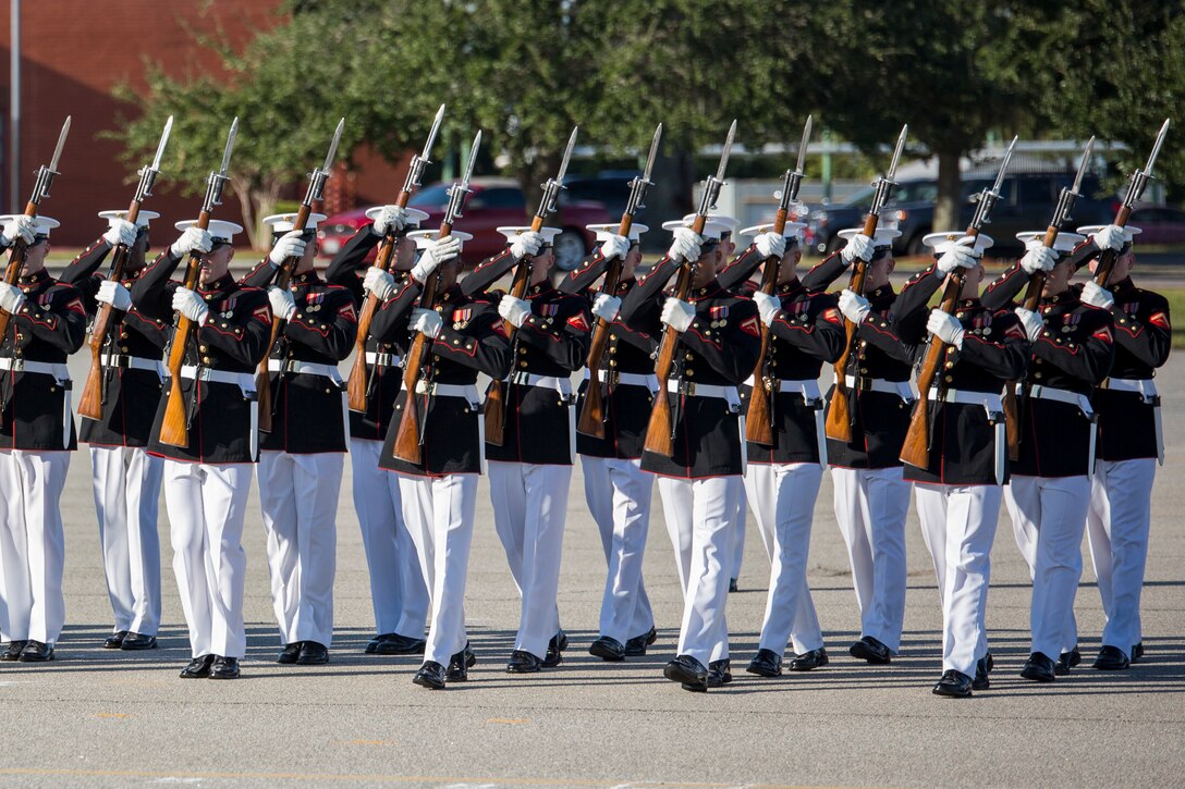 Marines of the Silent Drill Platoon perform a precision drill movement with M1 Garand rifles Oct. 16, 2015, on Parris Island, S.C. The platoon, assigned to the Battle Color Detachment based without verbal commands in front of recruits, Marines and civilians. The performance was part of Parris Island’s Centennial. (Photo by Lance Cpl. Vanessa Austin)