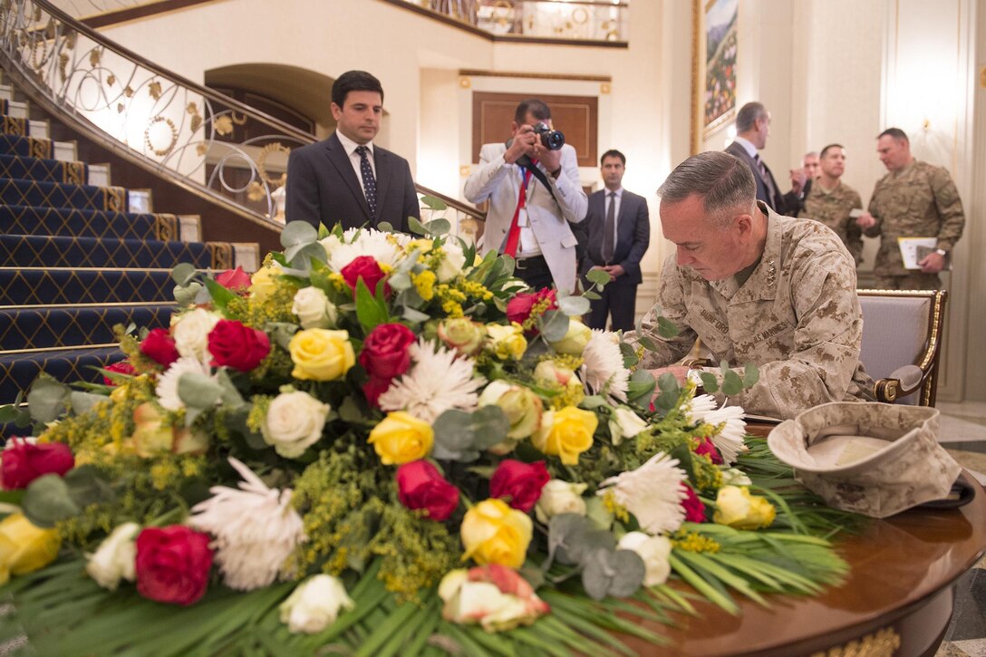 U.S. Marine Corps Gen. Joseph F. Dunford Jr., chairman of the Joint Chiefs of Staff, signs a guest book at the president's residence in Irbil, Iraq, Oct. 20, 2015. DoD photo by D. Myles Cullen