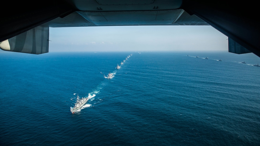 A U.S. Marine Corps MV-22B Osprey flies over the Japan Maritime Self-Defense Force warships, near Tokyo Bay, during the 28th iteration of the JMSDF Fleet Review, Oct. 18, 2015. Approximately 28 aircraft from the JMSDF, U.S. Navy, and U.S. Marine Corps flew above the warship. The fleet review allowed the JMSDF to assess its readiness and demonstrated the Japanese and the U.S. commitment to enduring prosperity and security in the Asia-Pacific region. 