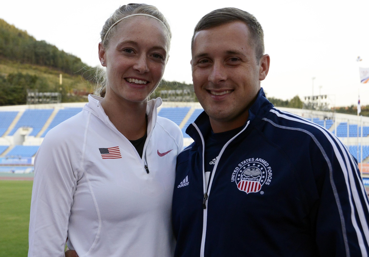 1st Lt. John Melcher of Fort Meade, Md., and his wife 2nd Lt. Annette Eichenberger Melcher of the Air Force Academy in Colorado Springs, embrace at the Military World Games in MunGyeong, South Korea, last week after she ran the 800-meter final.  She finished 8th with a time of 2:07.61 on Oct. 5, 2015.
