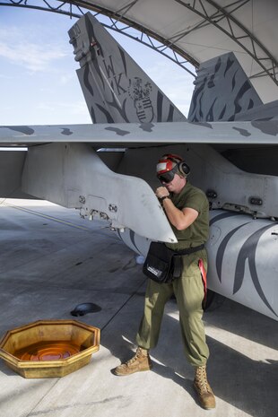 Lance Cpl. Charles Harwell, an aviation ordinance technician with Marine All Weather Fighter Attack Squadron 224, spins out explosive cartridges on a F/A-18 Hornet at Marine Corps Air Station Iwakuni, Japan, Oct. 15, 2015. The squadron came to the station from MCAS Beaufort, N.C., in support of the unit deployment program, which is a six-month deployment away from a unit’s United States homebase.