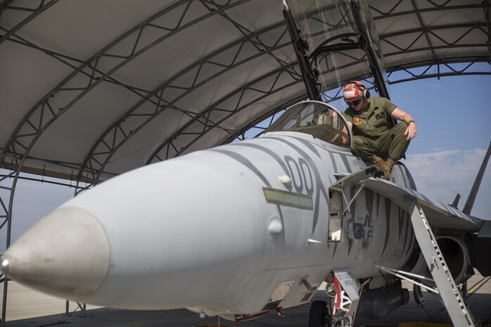Lance Cpl. Charles Harwell, an aviation ordinance technician with Marine All Weather Fighter Attack Squadron 224, checks the armament switches in the cockpit of a F/A-18 Hornet at Marine Corps Air Station Iwakuni, Japan, Oct. 15, 2015. The squadron, originally stationed in MCAS Beaufort, N.C., came to the station in support of the unit deployment program replacing VMFA(AW)-225.