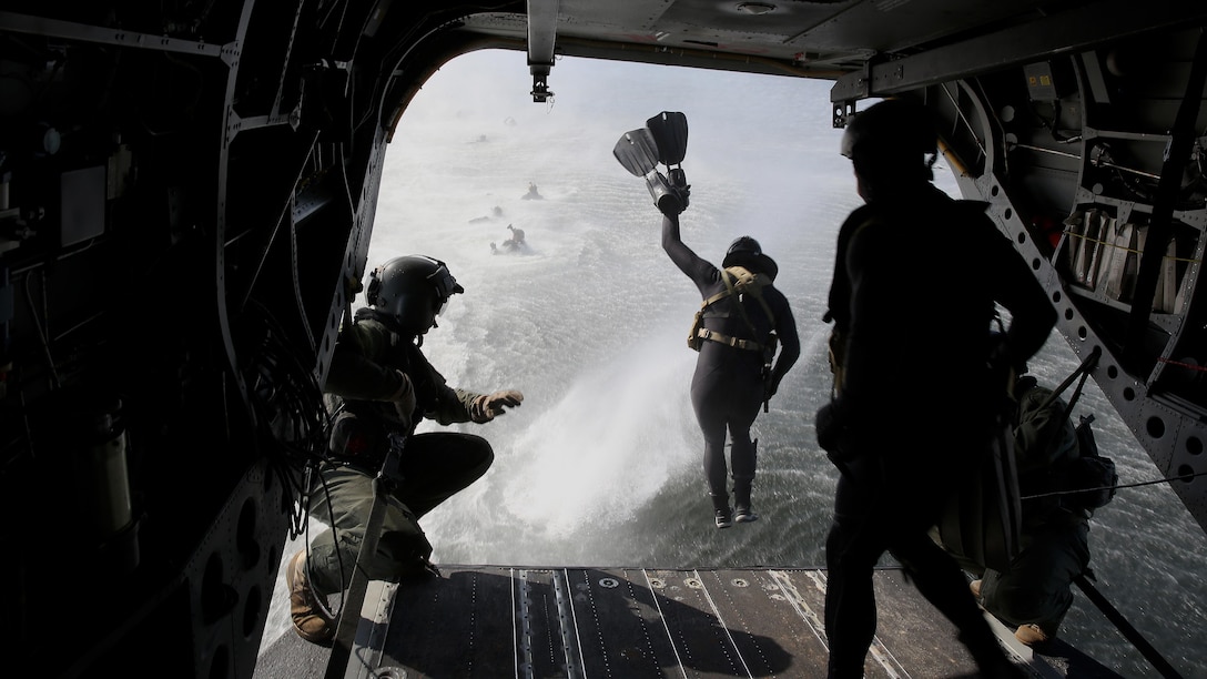 A Marine Raider with 1st Marine Raider Battalion jumps from the ramp of a CH-47 Chinook helicopter into the ocean during helocast training, Feb. 6, 2015, off the coast of Florida. The helocast training was part of a two-week  HAVEACE exercise, and part of the participating Marine Special Operations Team’s unit training program.