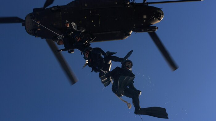 Marine Raiders with 1st Marine Raider Battalion dangle from a CH-47 Chinook helicopter during Special Patrol Insertion and Extraction rigging training operations, Feb. 6, 2015, near Hurlburt Field, Fla. The SPIE rigging training was part of a two-week HAVEACE exercise, and part of the participating Marine Special Operations Team’s unit training program.