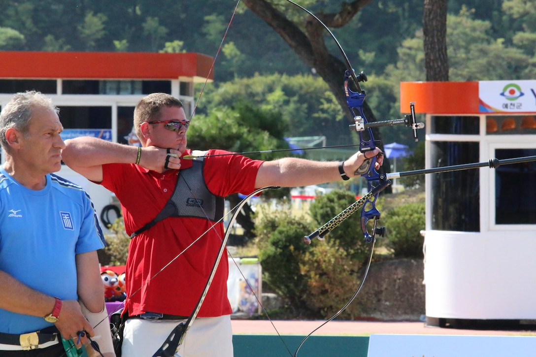 Army Staff Sgt. Michael Lukow aims at the target during his match up against Colonel Romaios Roumeliotis from Greece during the 6th CISM Military World Games Para-Archery competition.  Lukow advanced to the finals to take home the silver medal