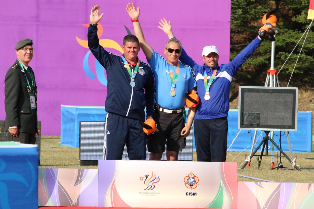 Army Staff Sgt. Michael Lukow aims (left) from Salt Lake City, Utah wins silver in the 6th CISM Military World Games Para-Archery Championship.   
