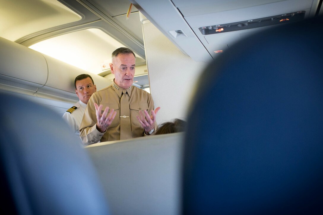 U.S. Marine Corps Gen. Joseph F. Dunford Jr., chairman of the Joint Chiefs of Staff, talks with reporters aboard a C-32 aircraft en route to Amman, Jordan, Oct. 19, 2015. DoD photo by D. Myles Cullen