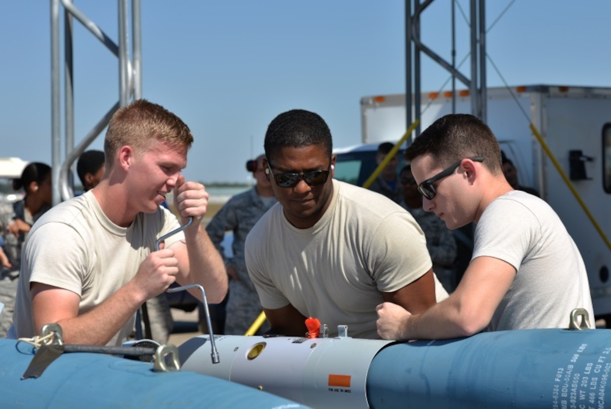 Airmen from the 33rd Aircraft Maintenance Squadron prepare a missile-guided bomb unit to be loaded into an F-35A Lightning II at Eglin Air Force Base, Fla., Oct. 16, 2015. Load crew members worked together to assemble the missile before loading it into the aircraft. (U.S. Air Force Photo/Senior Airman Andrea Posey)