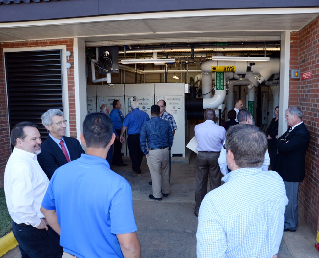 Attendees tour America’s first Borehole Thermal Energy Storage system - a state-of-the-art ground source heat pump system – after a ribbon-cutting ceremony at Building 3700, here, Oct. 19.