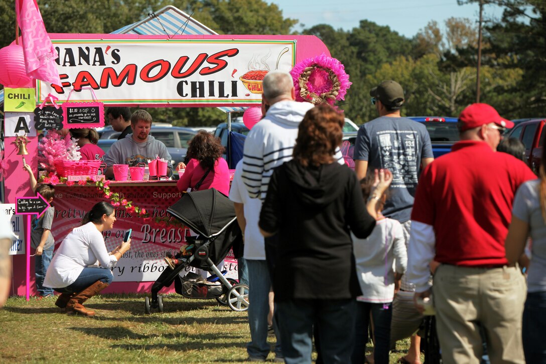 Participants wait in line as they prepare to taste chili from Nana’s Famous Chili booth during the  34th annual Havelock Chili Festival hosted by the Havelock Chamber of Commerce at the Walter B. Jones Park in Havelock, N.C., Oct. 16, 2015. Along with the assistance of Marine volunteers and other volunteers, the chamber raises funds for local charities and sees who has the best chili and Buffalo wings. The winner goes on to compete in the International World Chili Championship. (U.S. Marine Corps photo by Lance Cpl. Jason Jimenez/Released)