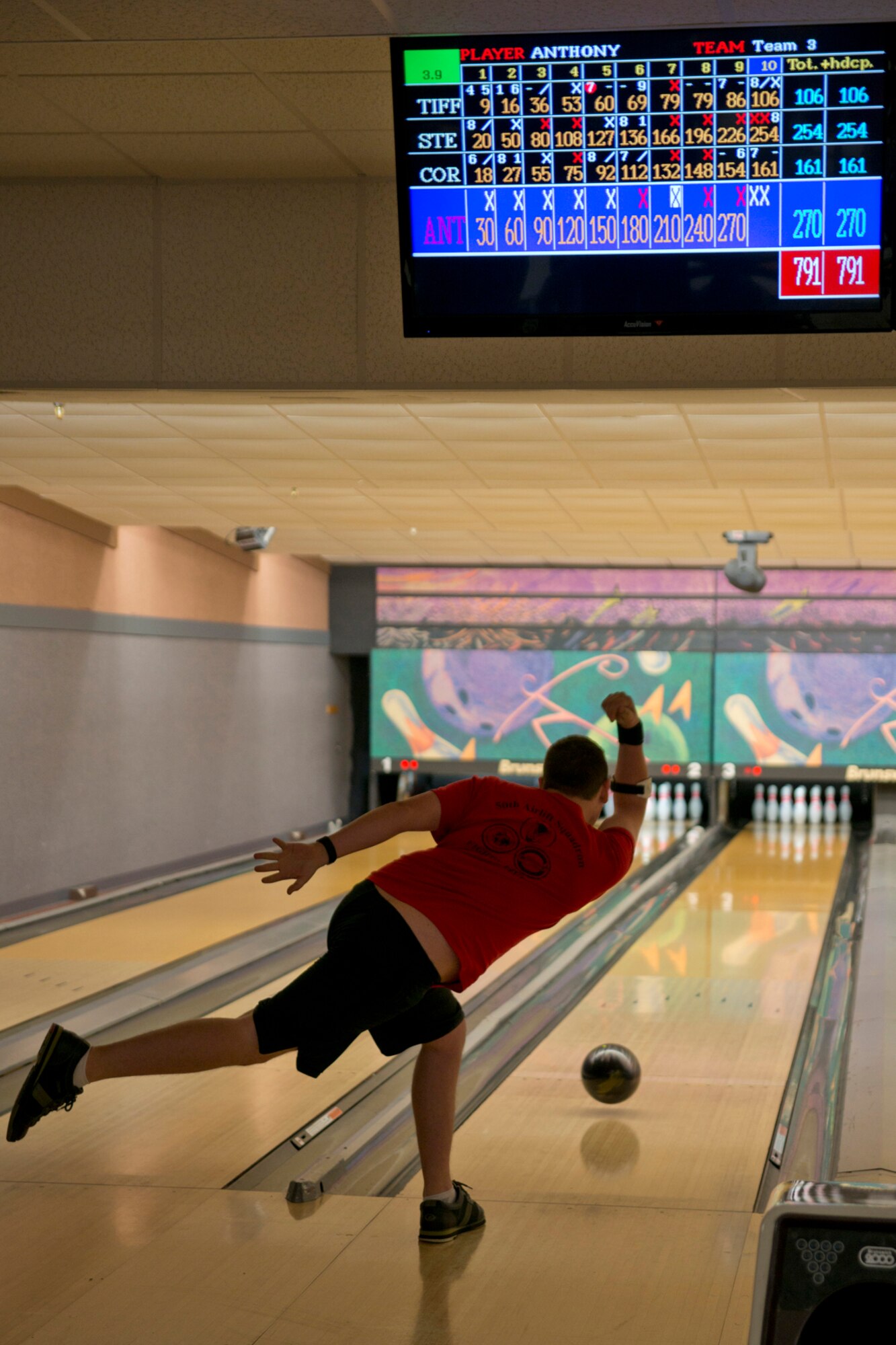 U.S. Air Force Senior Airman Anthony Szeluga, 50th Airlift Squadron, loadmaster, rolls what may be the final ball in a quest for the “perfect game” during the “sports day” Bowling Tournament, Oct. 8, 2015, on Little Rock Air Force Base, Ark. Hundreds of Airmen competed and volunteered at the base-wide event which  included more than 15 team competitions. (U.S. Air Force photo by Master Sgt. Jeff Walston/Released)