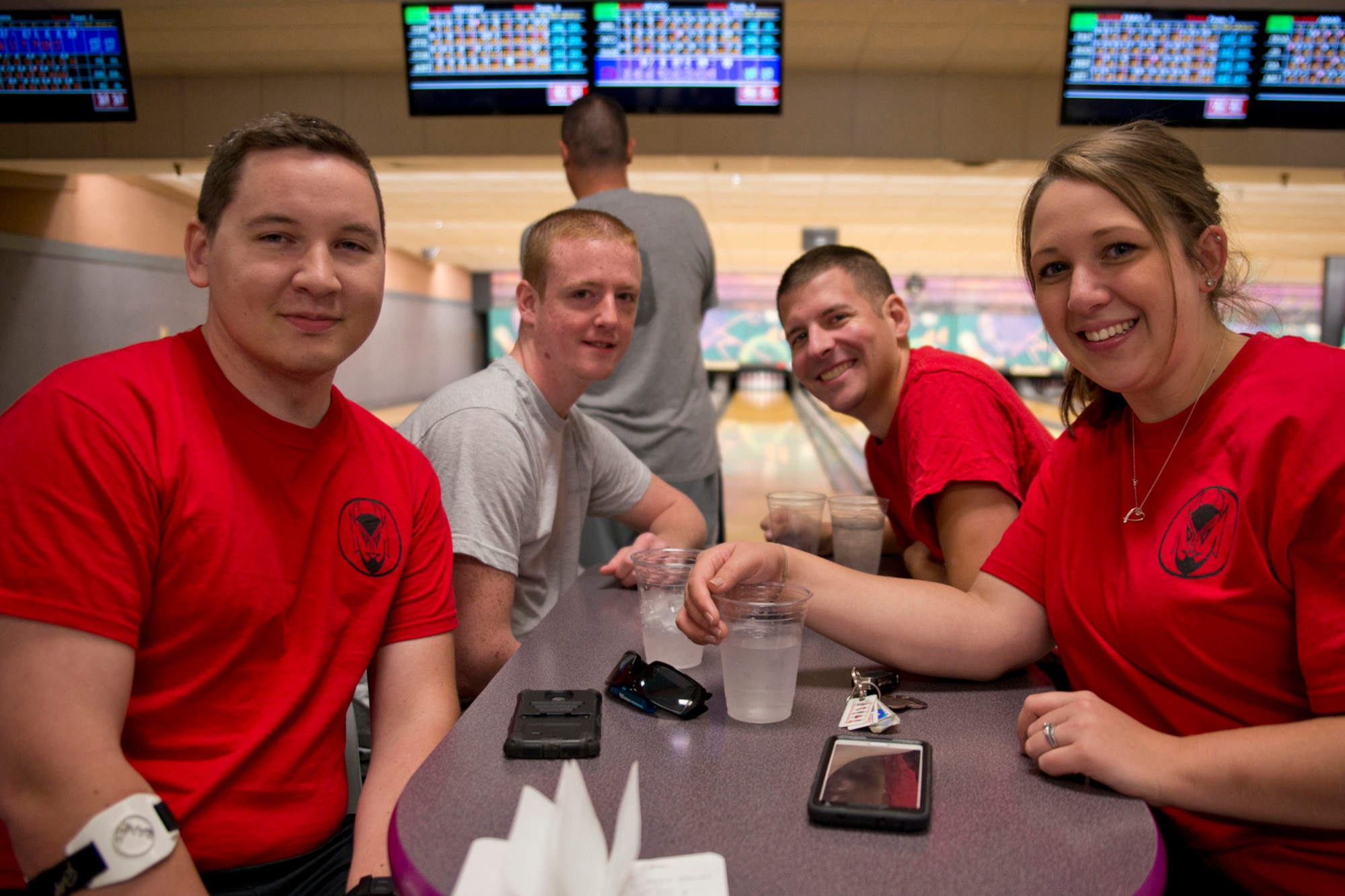 From left, U.S. Air Force Senior Airmen Anthony Szeluga, 50th Airlift Squadron, loadmaster, Corey Wright, 61st Airlift Squadron, loadmaster, Steven Bargmann, 50th AS, crew chief; and Tiffany Raimes, 50th AS, loadmaster, pose for a photo after a bowling tournament Oct. 8, 2015, where Szeluga bowled a perfect game at Little Rock Air Force Base, Ark. The final score for the 4-person team was 821, enough to take first place in the Session 1 Bowling Tournament of the Sports Day event on Little Rock AFB. (U.S. Air Force photo by Master Sgt. Jeff Walston/Released)