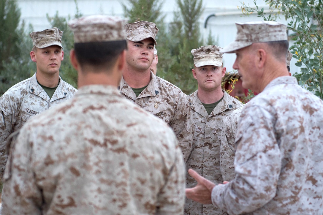 U.S. Marine Corps Gen. Joseph F. Dunford Jr., chairman of the Joint Chiefs of Staff, talks with U.S. Marines at a joint training center near Amman, Jordan, Oct. 19, 2015. DoD photo by D. Myles Cullen