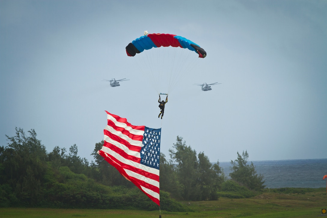 A member of the Flying Leathernecks, a civilian skydiving organization, parachutes onto the tarmac from a U.S. Army CH-47 Chinook helicopter during the Kaneohe Bay Air Show at Marine Corps Base Hawaii, Oct. 17. 2015. U.S. Marine Corps photo by Cpl. Aaron S. Patterson