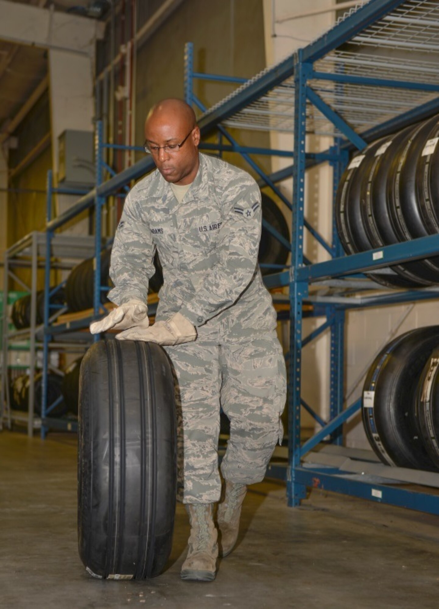 Airmen 1st Class Kristopher Adams, 96th Logistics Readiness Squadron F-35 supply apprentice, prepares a tire for delivery at Eglin Air Force Base, Fla., Oct. 15, 2015. Materiel management Airmen handle aircraft parts to maintain the F-35 Lightning II aircraft here. (U.S. Air Force Photo/Senior Airman Andrea Posey)