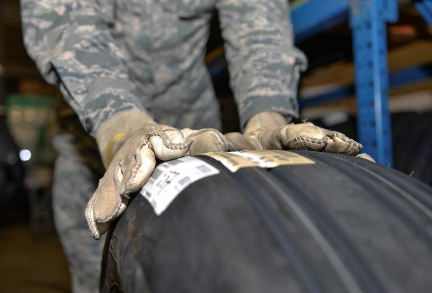 Airmen 1st Class Kristopher Adams, 96th Logistics Readiness Squadron F-35 supply apprentice, prepares a tire for delivery at Eglin Air Force Base, Fla., Oct. 15, 2015. Supplies from the warehouse go to multiple units such as the 58th Aircraft Maintenance Unit, 33rd Aircraft Maintenance Squadron, Navy Strike Fighter Squadron 101 Grim Reapers and the Air Education Training Command Academic Training Center. (U.S. Air Force Photo/Senior Airman Andrea Posey) 