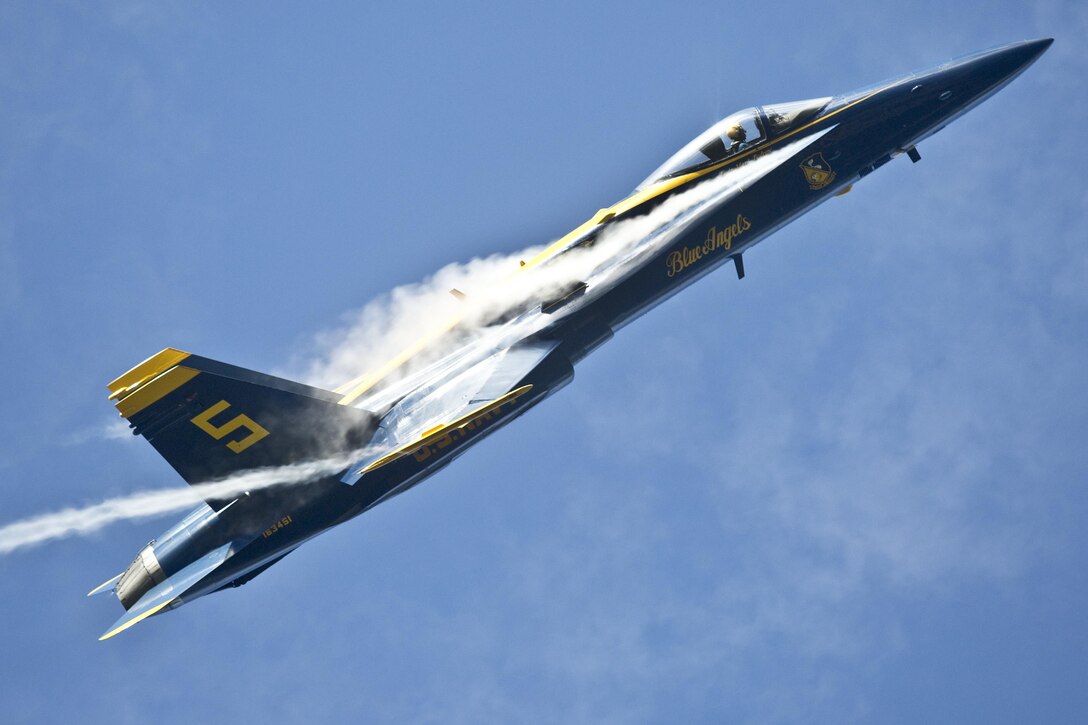 Navy Lt. Cmdr. Mark Tedrow, pilot number five with the Blue Angels, the U.S. Navy's flight demonstration squadron, performs aerial acrobatics during the 2015 Kaneohe Bay Air Show at Marine Corps Base Hawaii, Oct. 18. 2015. U.S. Marine Corps photo by Cpl. Brittney Vito