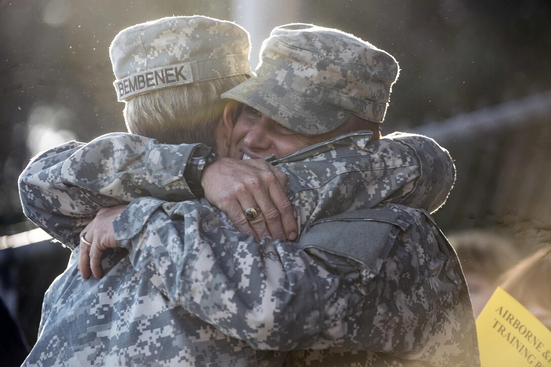 U.S. Army Maj. Lisa Jaster, an Army reservist assigned to the U.S. Army Corps of Engineers, celebrates prior to graduating Ranger School on Fort Benning, Ga., Oct. 16, 2015. Jaster is the third woman to graduate Ranger School. (U.S. Army photo by Staff Sgt. Alex Manne/ Released)