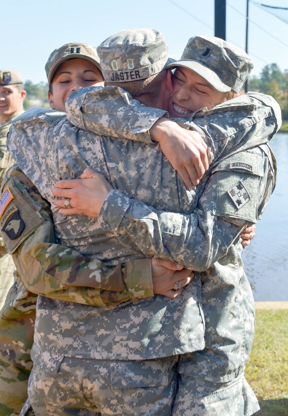 U.S. Army Maj. Lisa Jaster is congratulated by Capt. Kristen Griest, left, and 1st Lt. Shaye Haver, right, following her graduation from Ranger School on Fort Benning, Ga., Oct. 16, 2015. Griest, Haver and Jaster are currently the only female Ranger School graduates. (U.S. Army photo by Staff Sgt. Alex Manne/ Released)