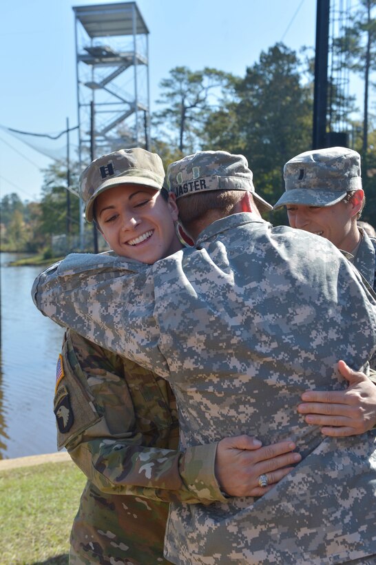 U.S. Army Maj. Lisa Jaster is congratulated by Capt. Kristen Griest, left, and 1st Lt. Shaye Haver following her graduation from Ranger School on Fort Benning, Ga., Oct. 16, 2015. Griest, Haver and Jaster are currently the only female Ranger School graduates. (U.S. Army photo by Staff Sgt. Alex Manne/ Released)