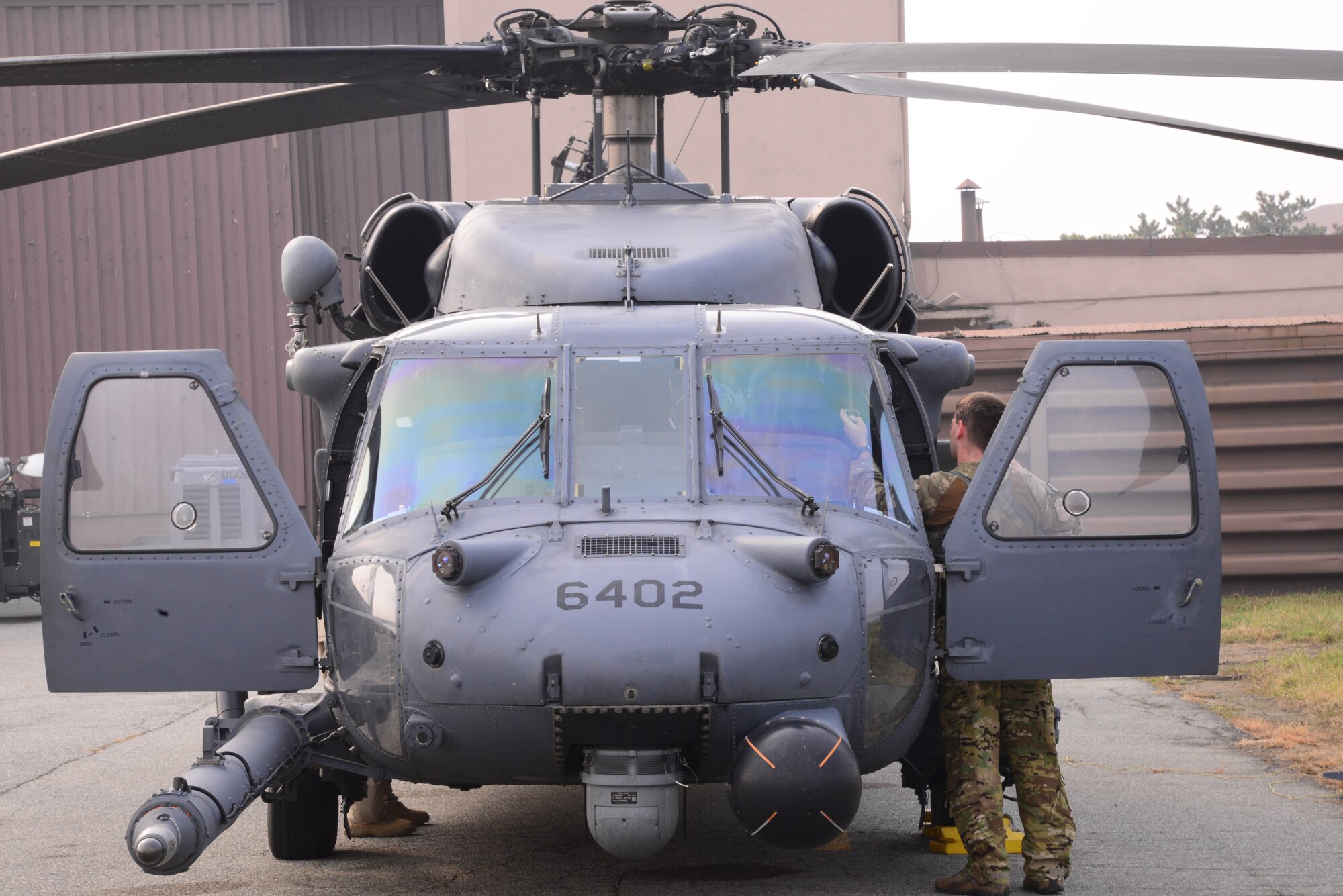A U.S. Air Force HH-60 Pavehawk carrying members from the 33rd Rescue Squadron prepares for takeoff Oct. 16, 2015, at Osan Air Base, Republic of Korea. The 33rd RQS members are from Kadena Air Base, Japan, and are participating in Exercise Pacific Thunder 15-02. (U.S. Air Force photo by Staff Sgt. Benjamin Sutton)