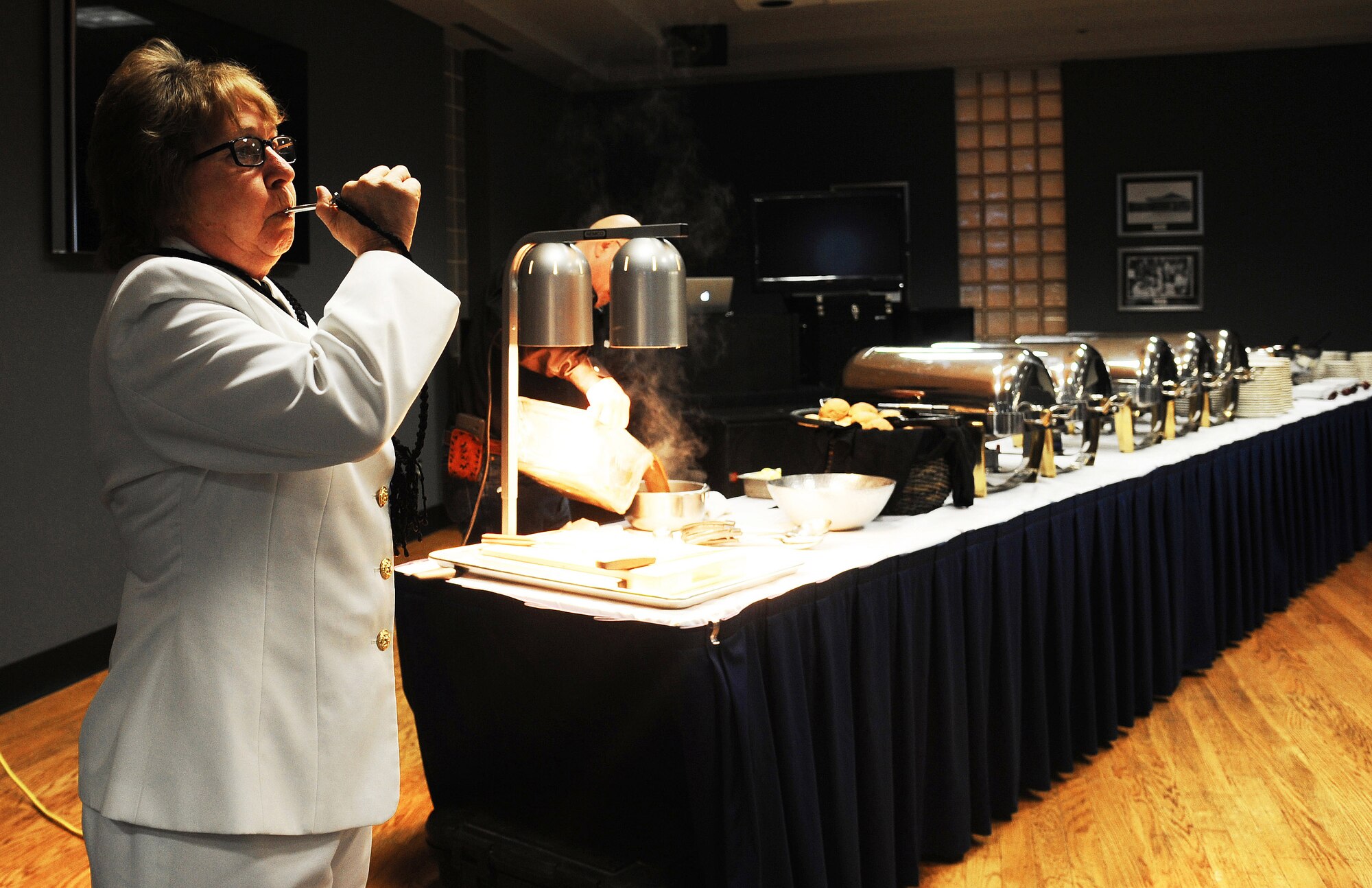 U.S. Navy Chief Petty Officer Carol J. Yoakum, Center for Information Dominance Navy Detachment instructor, blows a boatswain’s whistle to signal dinner time during the Navy Day Ball at the Event Center on Goodfellow Air Force Base, Oct. 9, 2015. This was the first Goodfellow Navy Day Ball in several years. (U.S. Air Force photo by Airman Caelynn Ferguson/Released)
