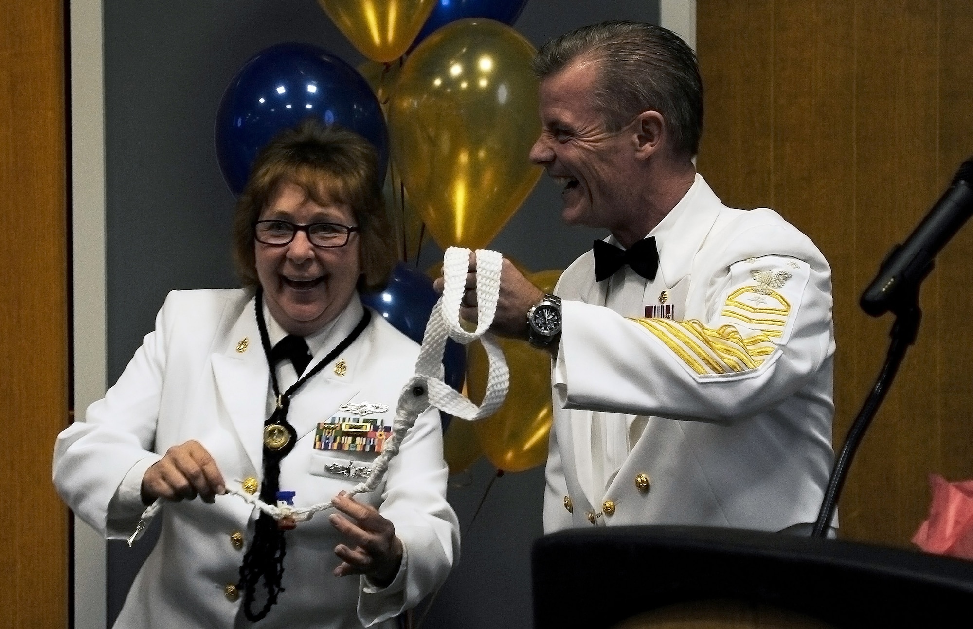 U.S. Navy Command Master Chief Christopher Angstead, Command Master Chief for Navy Medicine Education and Training Command Headquarters, receives a boatswain’s whistle as a gift during the Navy Day Ball at the Event Center on Goodfellow Air Force Base Oct. 9, 2015. The boatswain’s whistle was handmade by Chief Petty Officer Carol J. Yoakum, Center for Information Dominance Navy Detachment instructor. (U.S. Air Force photo by Airman Caelynn Ferguson/Released)