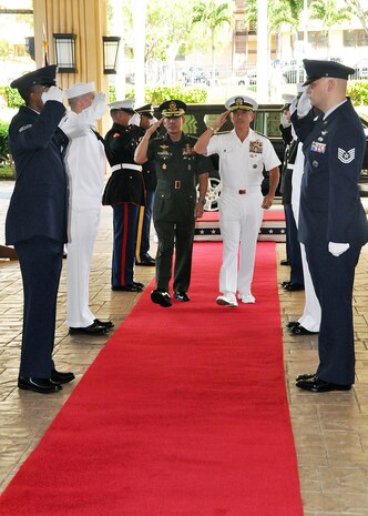 CAMP H.M. SMITH, Hawaii - Chief of Staff of the Armed Forces Philippines, Gen. Hernando Iriberri, and the Commander of U.S. Pacific Command, Adm. Harry Harris Jr., render honors during a ceremony at the USPACOM headquarters Oct. 19.  Gen. Iriberri visited USPACOM to co-chair the Mutual Defense Board and Security Engagement Board with Adm. Harris.  Held annually since 1958, the boards provide a venue for strategic discussions on shared security topics.  Board members consist of the U.S. and Philippine Service commanders, Philippine Coast Guard, Philippine National Police, Joint Interagency Task Force- West  and the U. S. Coast Guard - Pacific Area.  Following the discussions, the co-chairs endorse the bilateral activities for the upcoming year. 