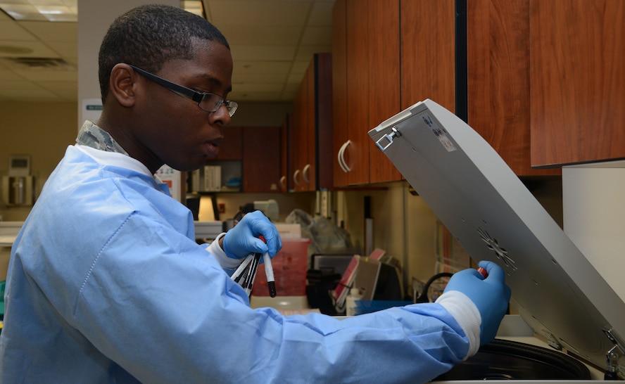 Airman 1st Class Samuel Lockard, 56th Medical Support Squadron laboratory technician, puts blood vials into the Beckman Coulter Allegra X-30 Centrifuge October 19, 2015 at Luke Air Force Base. The Beckman Coulter Allegra X-30 Centrifuge spins blood at 3056 revolutions per minute separating plasma from the blood. (U.S. Air Force photo by Airman 1st Class Cory Gossett)