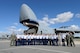 Latin American Cadets, hosts from the Secretary of the Air Force's office of International Affairs and personnel from the 436th Airlift Wing pose in front of a C-5M Super Galaxy after a tour of the aircraft Oct. 15, 2015, at Dover Air Force Base, Del. The nose of the aircraft is in the raised position as part of the demonstration given to the cadets showing how heavy equipment can roll-on/roll-off of the cargo transport aircraft. (U.S. Air Force photo/Greg L. Davis)