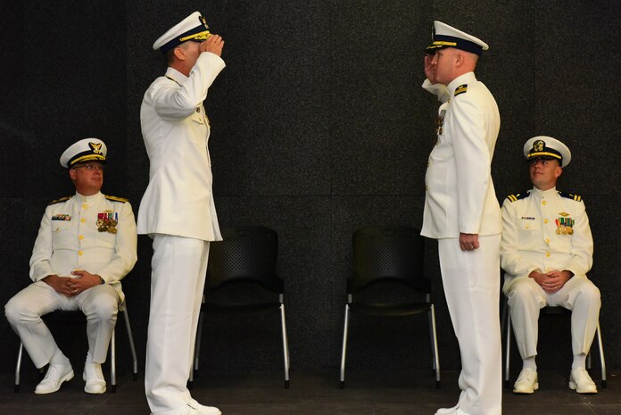 Rear Adm. James M. Heinz, second from left, the director of operational logistics for the Coast Guard, salutes Cmdr. Michael J. Paradise, second from right, the commanding officer of Coast Guard Base Charleston, S.C., during a ceremony at the Federal Law Enforcement Training Center in Charleston, Oct. 19, 2015. The ceremony was held to observe the establishment of Coast Guard Base Charleston, which will integrate mission support activity and align logistics in the northern areas of the 7th Coast Guard District. (U.S. Coast Guard photo by Petty Officer 2nd Class Anthony L. Soto)