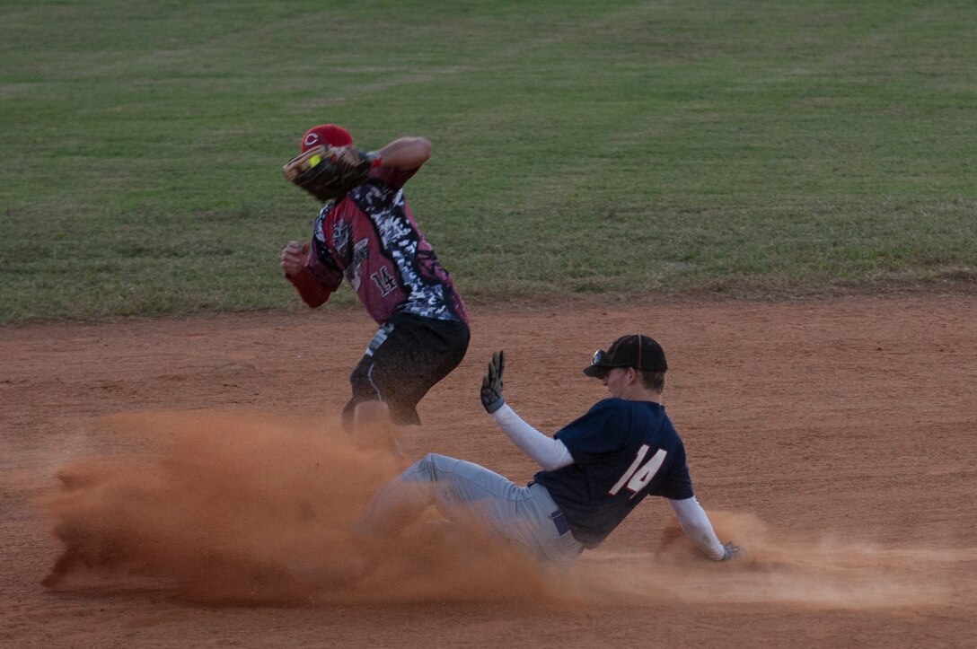 Matthew Kelgard, Fort Eustis All-Stars outfielder, slides into second base during the Joint Base Langley-Eustis All-Stars Softball game at Langley Air Force Base, Va., Oct. 14, 2015. The All-Stars softball game marked the second match-up in the ongoing Commander’s Cup competition between U.S. Service members from Fort Eustis and Langley Air Force Base. (U.S. Air Force photo by Senior Airman R. Alex Durbin/Released)